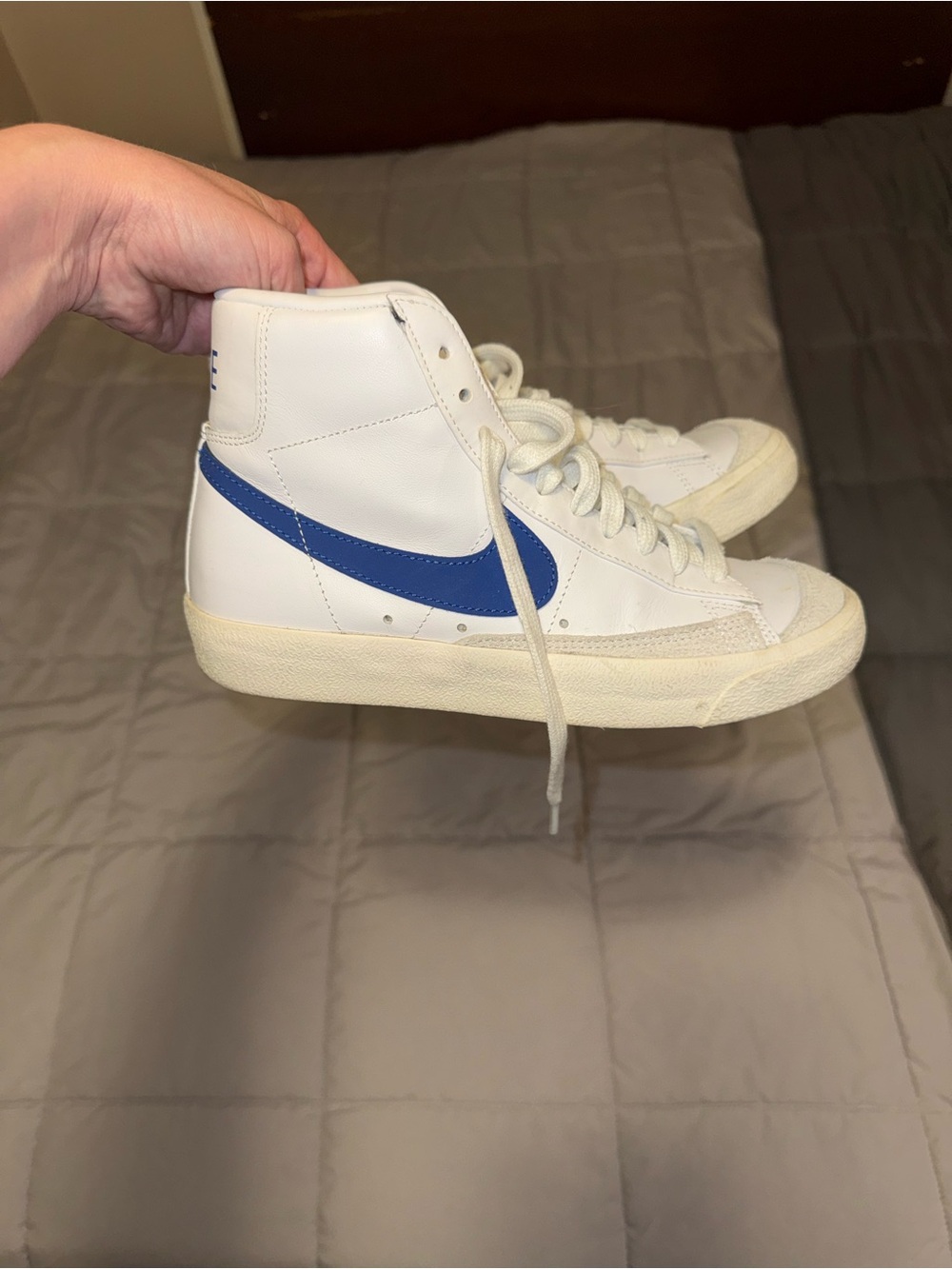 Nike White High-Top Sneakers with Blue Swoosh